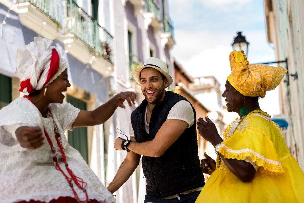 tourist dancing with locals